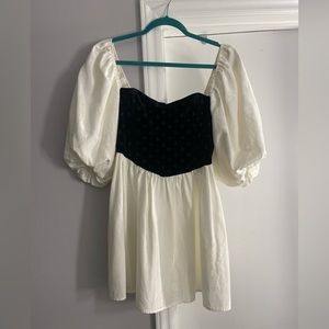 for love & lemons black and white mini dress with puff sleeves